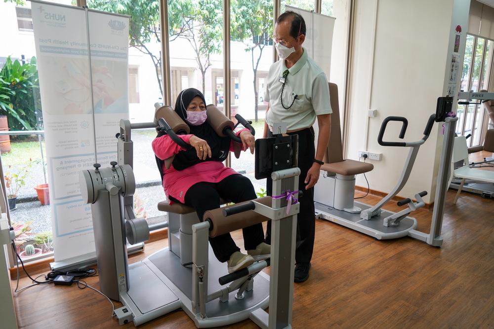 Assisting with Gym Tonic sessions is one of Mr Tan’s (right) key responsibilities at SEEN. (Photo by Chan May Ching)